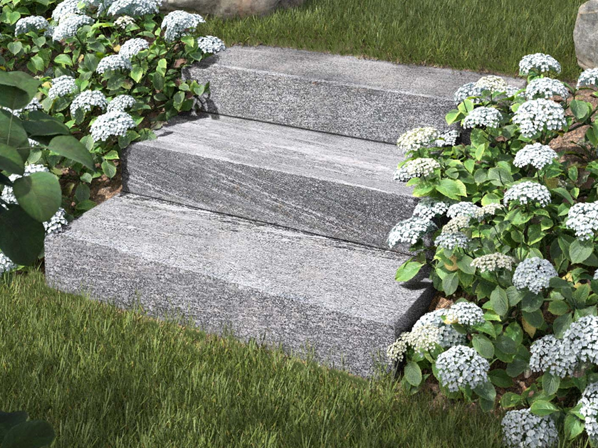 Gneiss Urban Grey Line muurblokken met bloemen en gazon