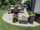 Bestrating Gneiss Urban Grey Line in groen met bloemen
